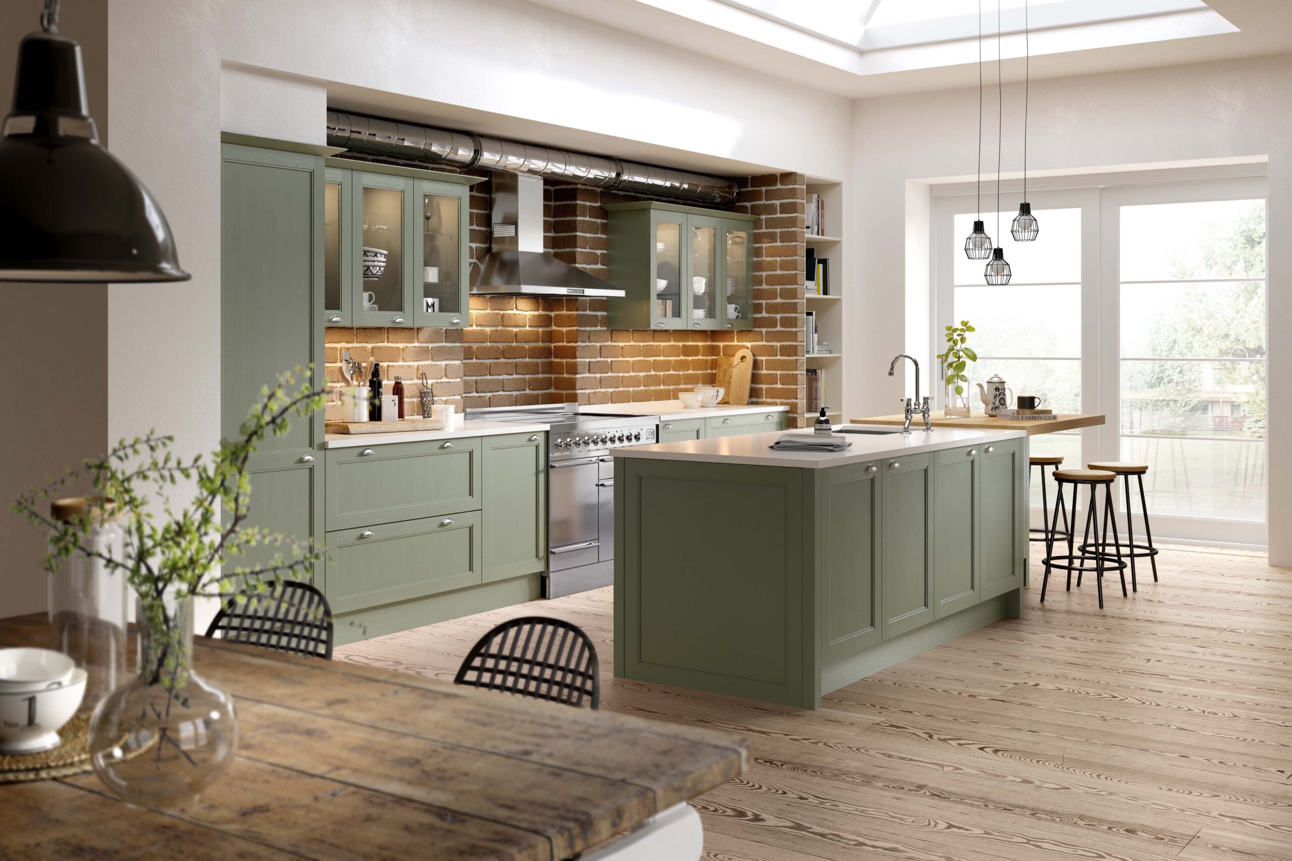 sage green classic kitchen with island and exposed brick splashback, traditional shaker kitchen with wooden flooring, country style kitchen with open plan dining area